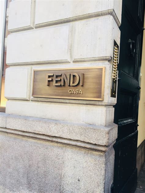 a building that has a sign that says fendi on it .